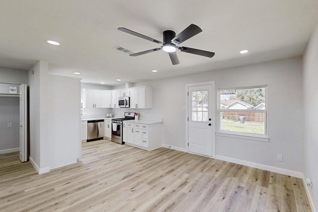 kitchen featuring light countertops, recessed lighting, light wood-style floors, stainless steel appliances, and a ceiling fan