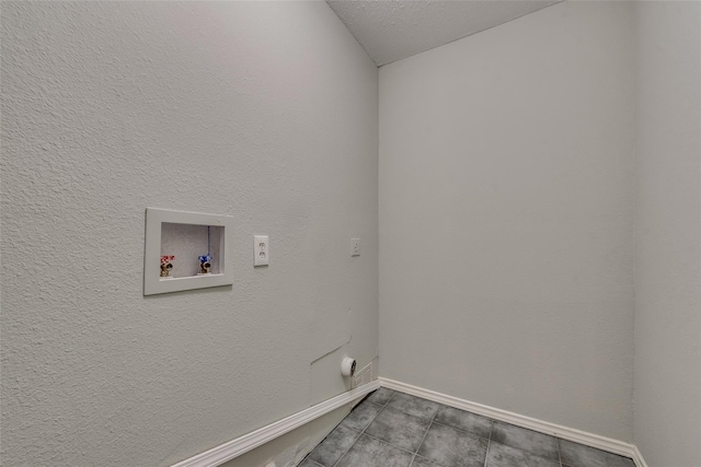 laundry area featuring washer hookup and baseboards