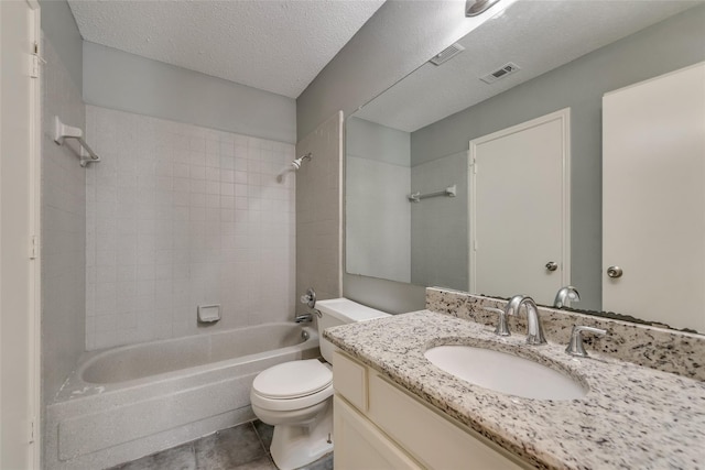 full bath with toilet, tub / shower combination, vanity, tile patterned floors, and a textured ceiling