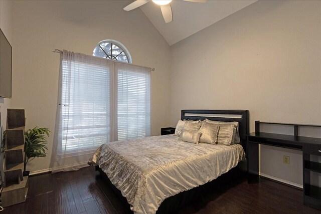 bedroom featuring hardwood / wood-style flooring, lofted ceiling, and ceiling fan