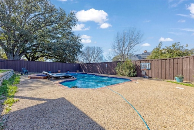 view of pool featuring a patio area, a fenced in pool, and a fenced backyard