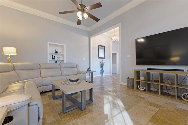 living room featuring crown molding, built in features, ceiling fan with notable chandelier, and baseboards