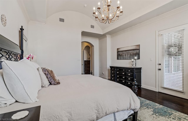 bedroom featuring wood finished floors, baseboards, visible vents, arched walkways, and vaulted ceiling