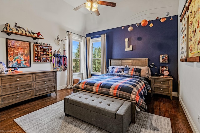 bedroom featuring vaulted ceiling, ceiling fan, baseboards, and wood finished floors