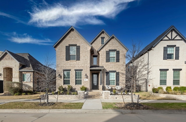 view of front of house featuring brick siding