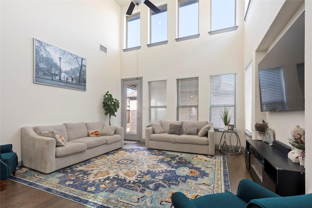 living room with wood finished floors and visible vents