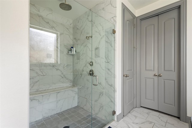 bathroom with marble finish floor and a marble finish shower