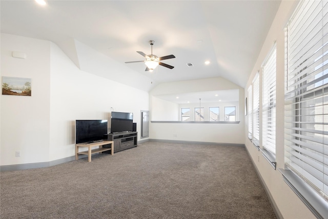 carpeted living area featuring recessed lighting, ceiling fan, baseboards, and lofted ceiling