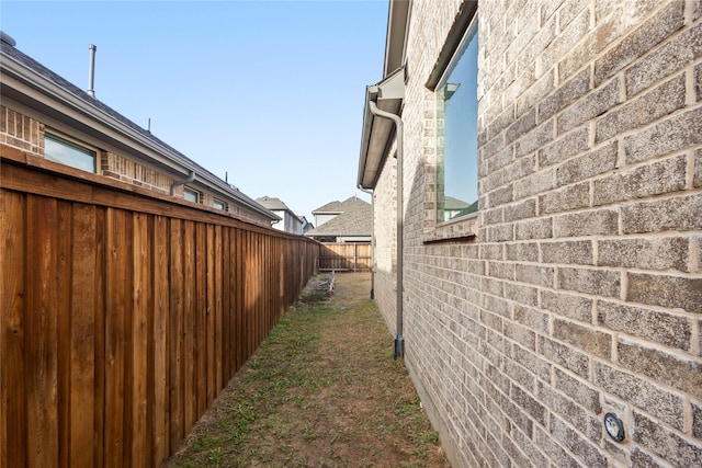 view of home's exterior featuring fence