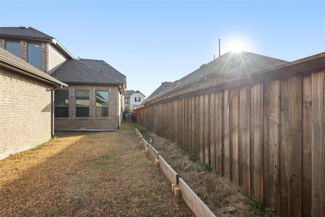 view of yard featuring a vegetable garden and fence