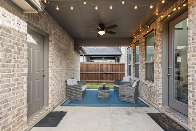 view of patio / terrace featuring a ceiling fan and fence