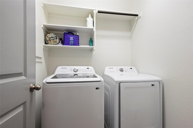 laundry room with laundry area and washing machine and dryer