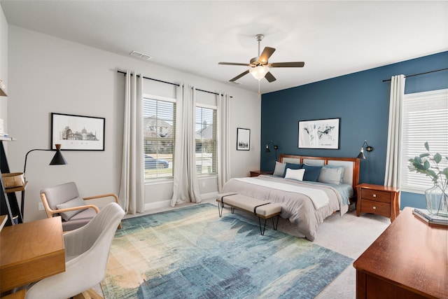 bedroom featuring baseboards, carpet floors, and ceiling fan