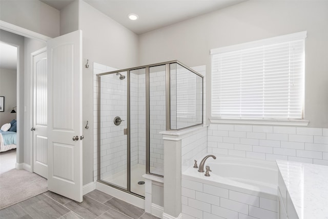 ensuite bathroom with a stall shower, ensuite bathroom, and a bath