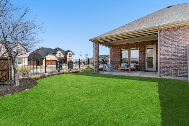 view of yard featuring a residential view, a patio, and fence private yard