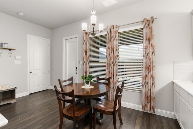 dining space with visible vents, baseboards, and dark wood-style floors