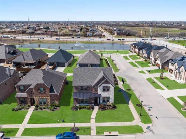 aerial view with a residential view and a water view