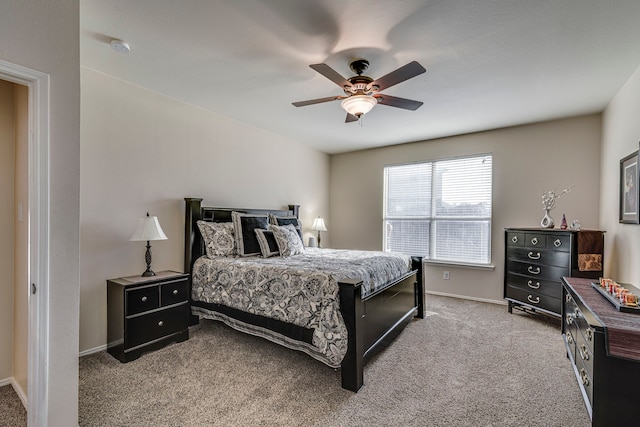 bedroom with carpet flooring, a ceiling fan, and baseboards