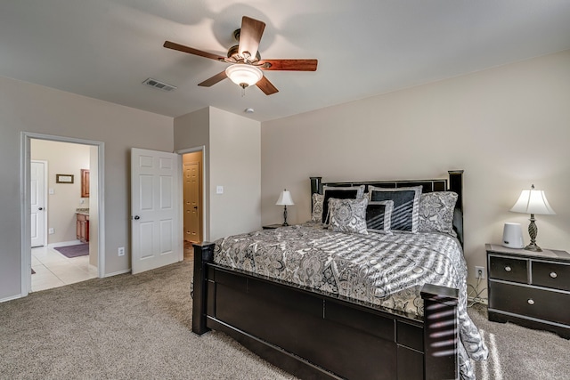 bedroom featuring visible vents, ensuite bath, carpet, baseboards, and ceiling fan