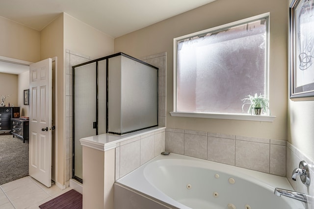 full bath with tile patterned flooring, a shower stall, and a jetted tub