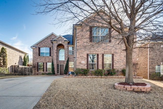 traditional-style home featuring brick siding