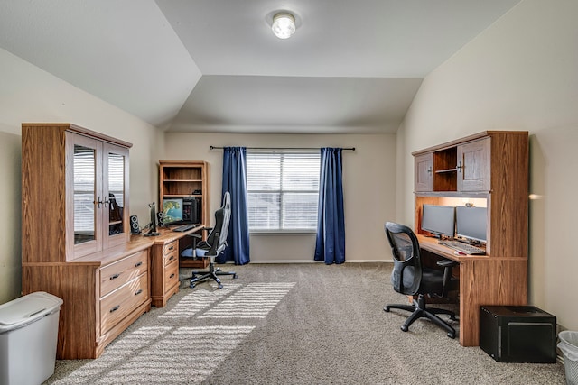 office area with light carpet, baseboards, and vaulted ceiling