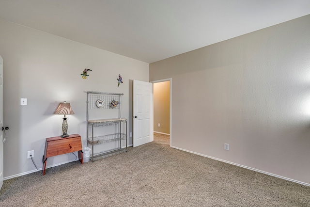 carpeted bedroom featuring baseboards