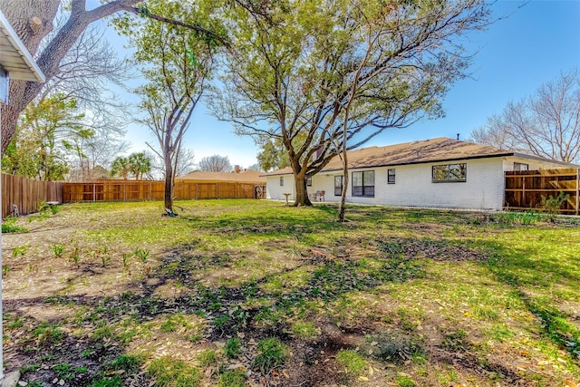 view of yard with a fenced backyard