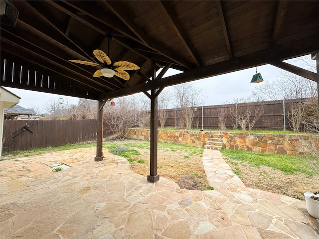 view of patio with a ceiling fan and a fenced backyard