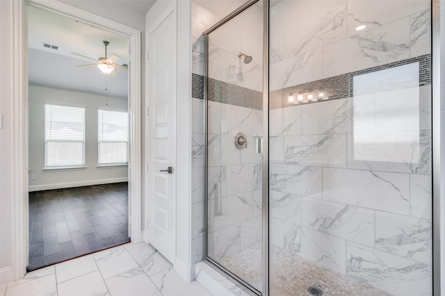 full bathroom with a marble finish shower, marble finish floor, ceiling fan, and visible vents