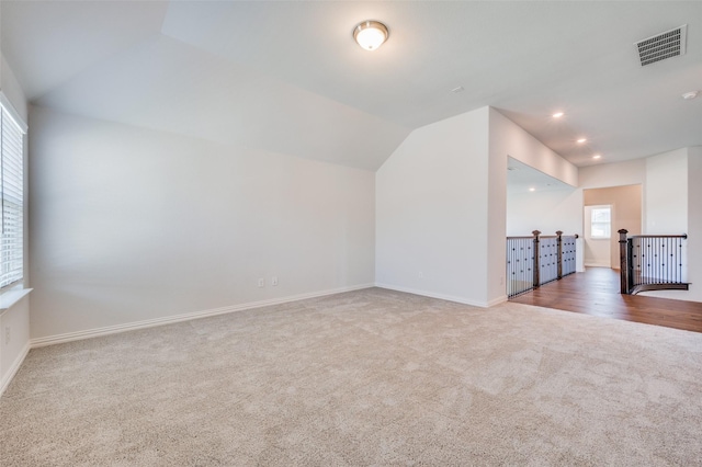 bonus room featuring visible vents, recessed lighting, baseboards, carpet flooring, and lofted ceiling