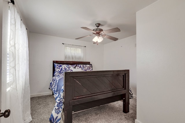 bedroom featuring baseboards, a ceiling fan, and carpet floors