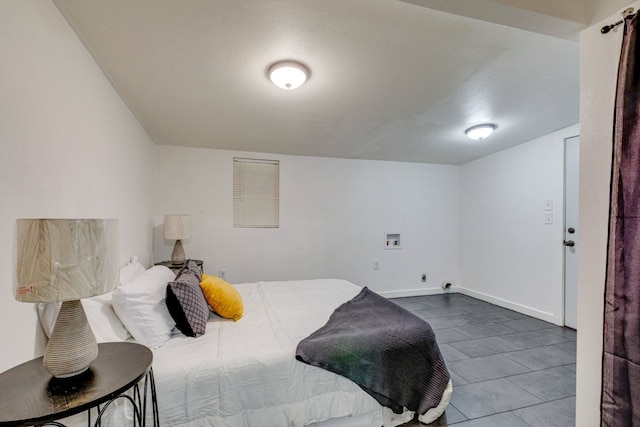 bedroom featuring baseboards