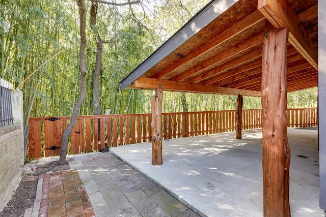 view of patio featuring fence