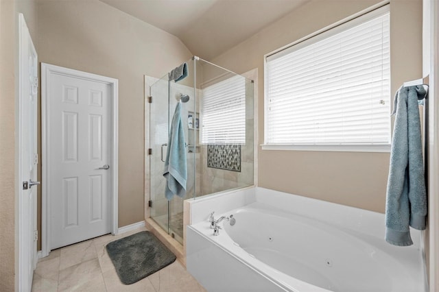 full bathroom with tile patterned floors, a shower stall, and a jetted tub