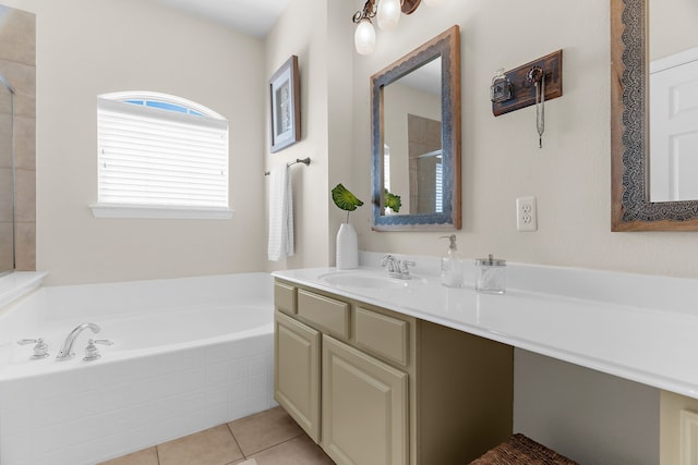 full bath featuring vanity, tile patterned floors, a bath, and walk in shower