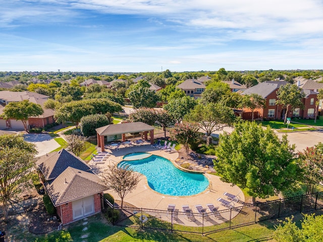 community pool with a gazebo, fence, a residential view, and a patio