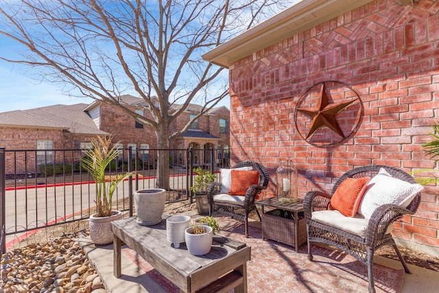 view of patio featuring fence