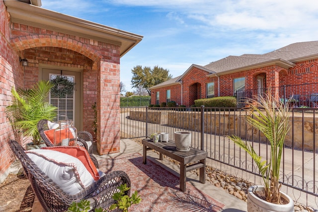 view of patio featuring fence