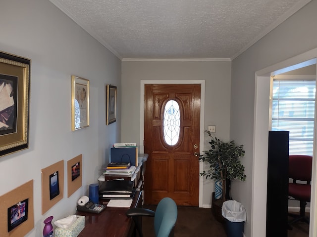 entrance foyer featuring ornamental molding, a wealth of natural light, and a textured ceiling