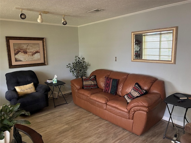 2039 Lovers Ln, Shreveport, LA 71105 - living room with crown molding, wood finished floors, rail lighting, and a textured ceiling