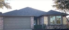 view of front facade featuring driveway and a garage