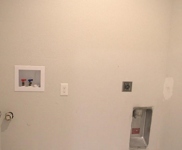 clothes washing area with hookup for a washing machine and hookup for an electric dryer