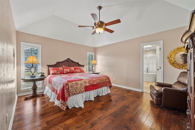 bedroom with hardwood / wood-style flooring, multiple windows, and vaulted ceiling