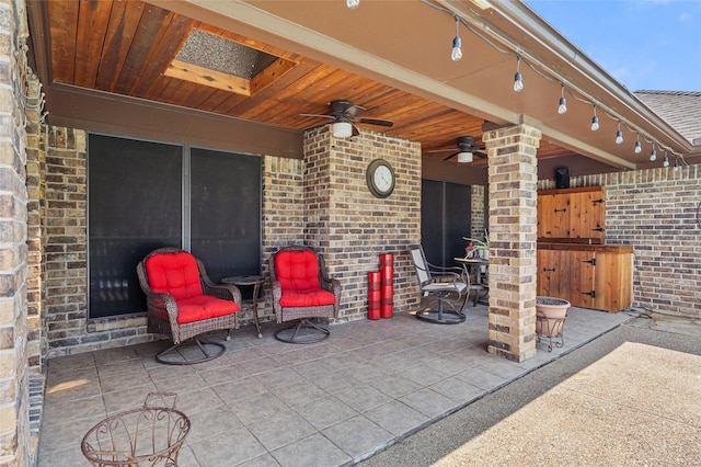 view of patio / terrace with fence and ceiling fan