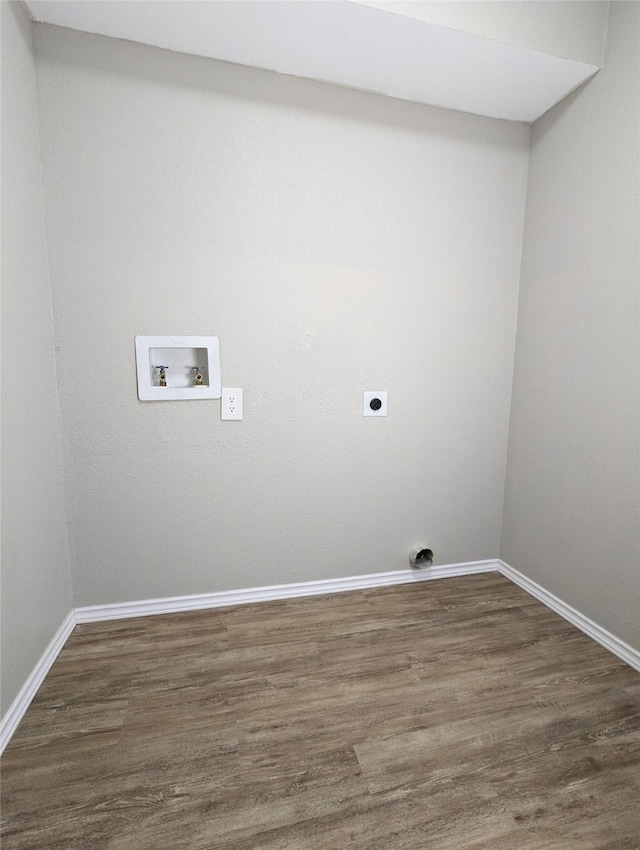 washroom featuring dark wood-type flooring, washer hookup, baseboards, hookup for an electric dryer, and laundry area