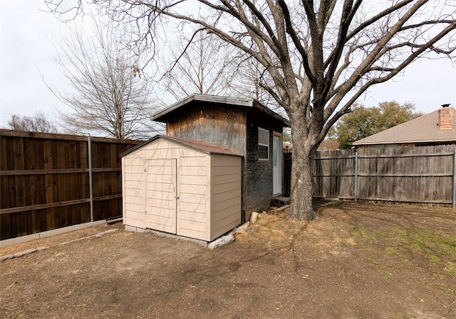 view of shed with a fenced backyard