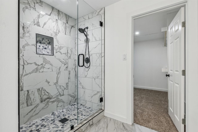 full bathroom featuring baseboards, marble finish floor, and a stall shower