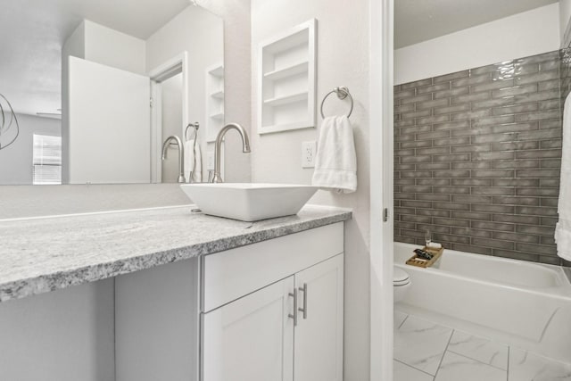 2240 Tarpley Rd Unit 451, Carrollton, TX 75006 - full bathroom with toilet, vanity, and marble look tile flooring