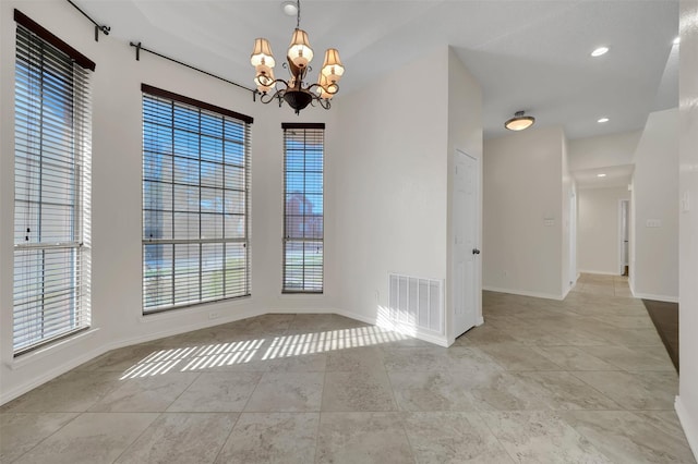 spare room featuring recessed lighting, visible vents, baseboards, and a chandelier